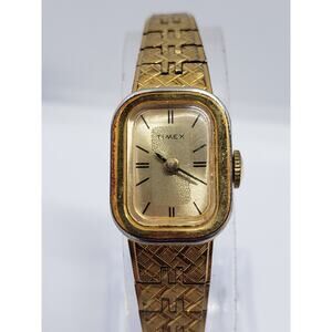 Women's Timex watch. Small Gold face with bracelet style band.